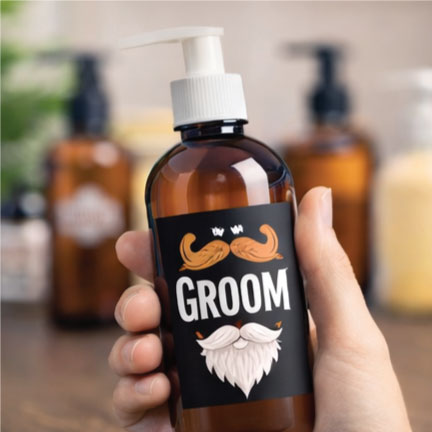 Bottle with label sticker showing “GROOM” text and illustrated mustache