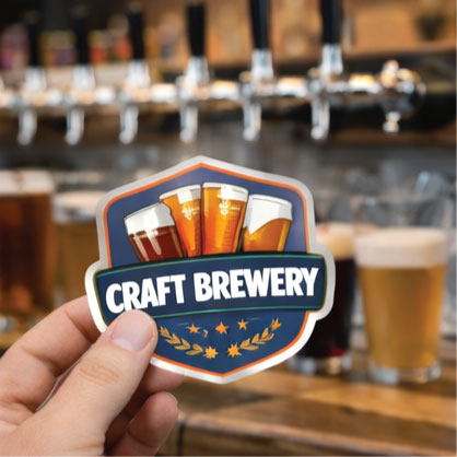 Craft brewery sticker, white shield with bold blue banner and beer-glass icons