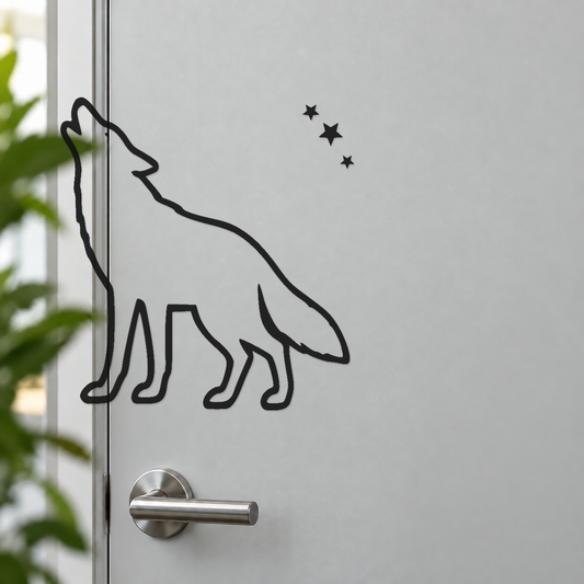 Howling coyote vinyl decal with three-star trail, black outline