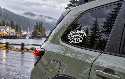 Car window vinyl decal with "One More Beautiful Step" lettering