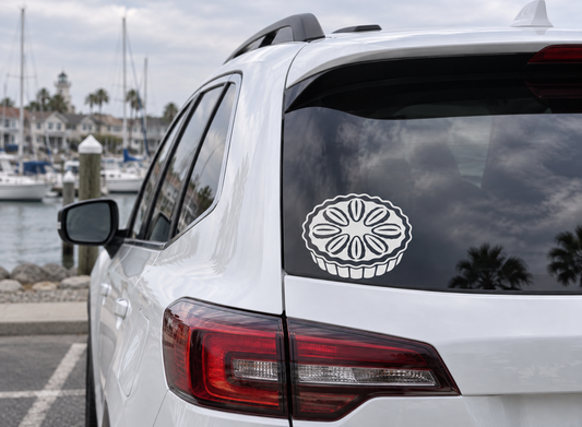 Pecan pie vinyl decal on car rear window, white outline on dark background