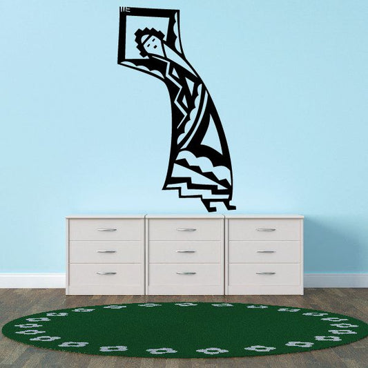 Stylized native deity decal with black-and-teal geometric figure
