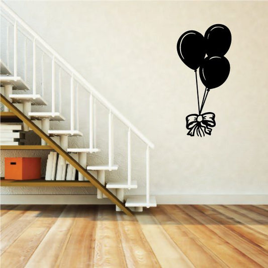 Black balloon decal with a tied bow and three balloons