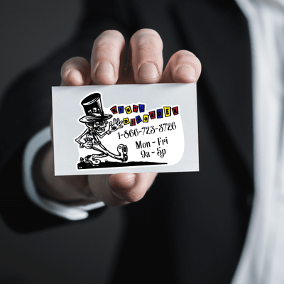 A professional presenting a business card sticker adorned with a cartoon illustration