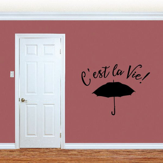 Wall decal: cursive 'C'est la Vie!' with black umbrella