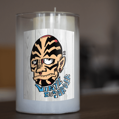 Sticker with a whimsical cartoon face for candle decoration