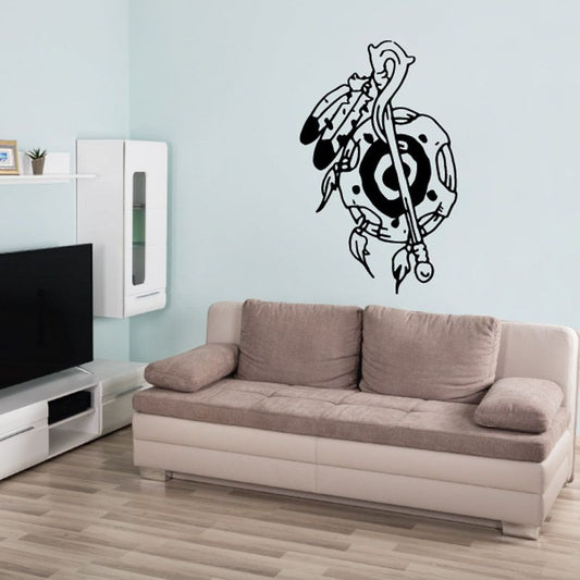 Black line-art wall decal of a musician holding a staff-like instrument