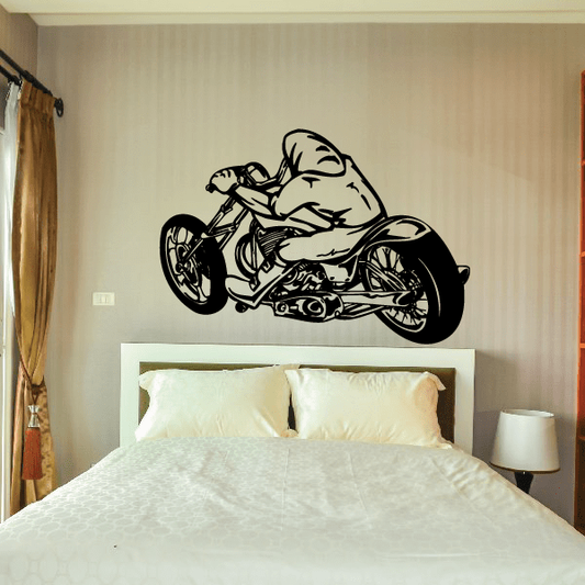 Chopper motorcycle wall decal in black vinyl, bold outline on a smooth surface