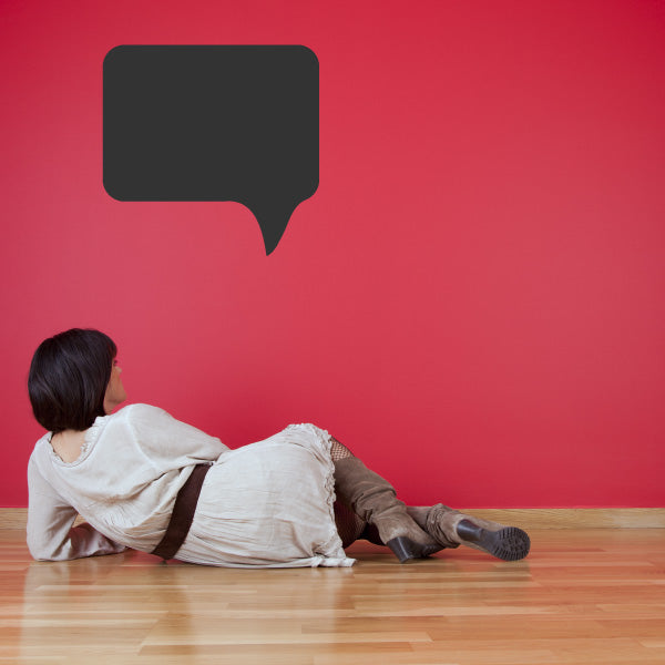 Rounded rectangle speech bubble wall decal with downward tail, dark gray