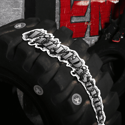 A Crossfit sticker with the word "vinyldisorder" affixed to a workout tire