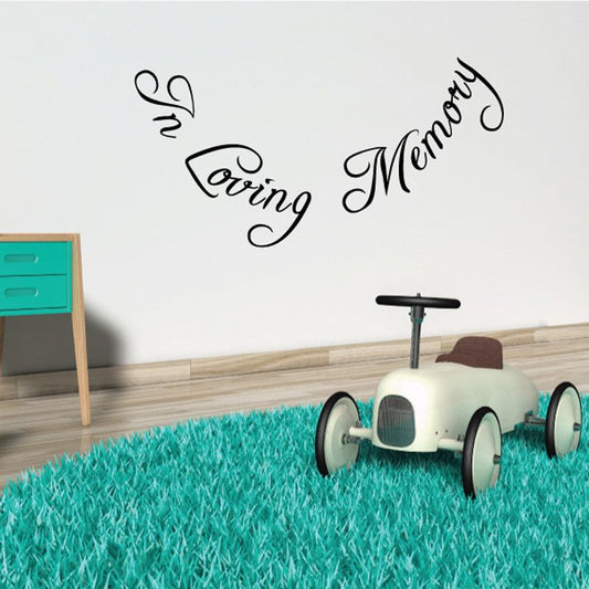 Black cursive memorial wall decal with "Loving Memory" text and small dove