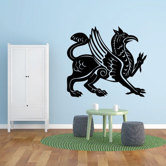 Black detailed griffin wall decal with wings spread and tail curled.