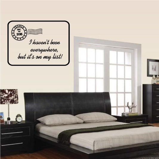 Wall quote decal with circular stamp and cursive text on a dark-bordered card