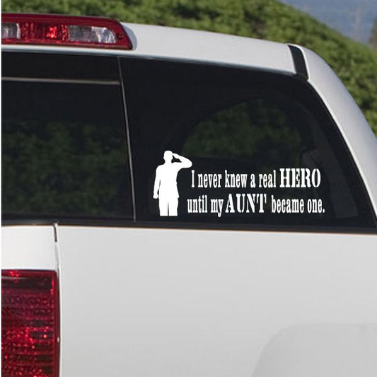 Car window decal with white soldier silhouette and quote text on dark glass