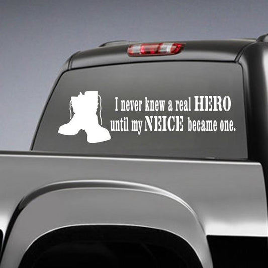 Car window decal: white silhouette with text “I never knew a real hero”