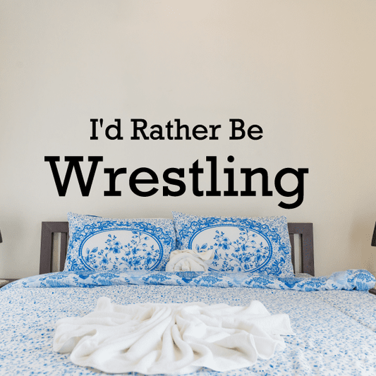 Wall decal text: “I'd Rather Be Wrestling” in large black lettering