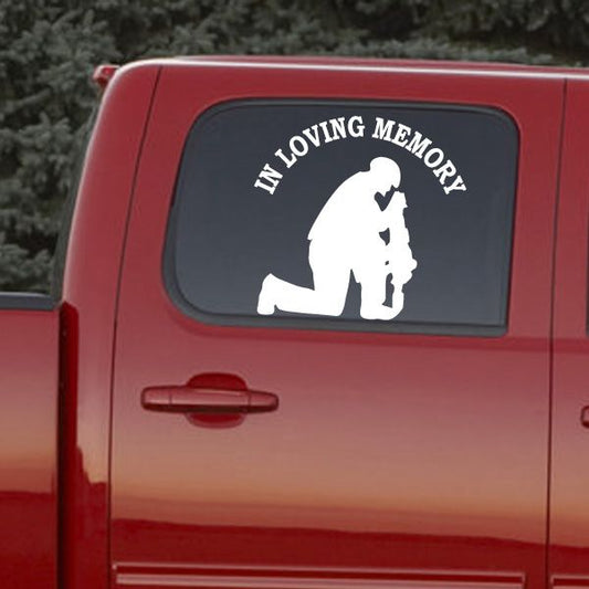 Car decal with 'In Loving Memory' and crouching soldier silhouette