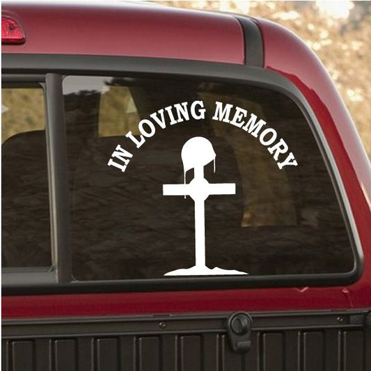 In loving memory window decal with white cross and curved text on dark background