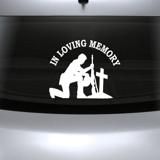 Custom car decal with white kneeling soldier holding a cross and “In Loving Memory” text