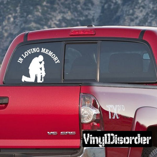 Custom car window decal with 'In Loving Memory' text and kneeling soldier on black