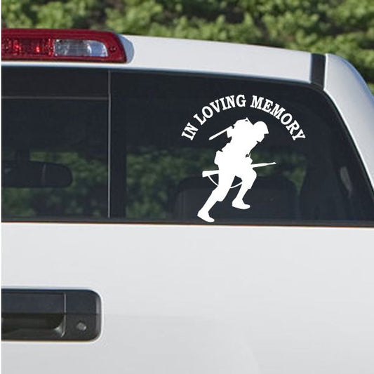 Car window decal with 'In Loving Memory' and running soldier silhouette.