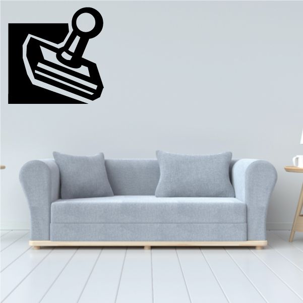 Joystick decal with black controller icon on rectangular background
