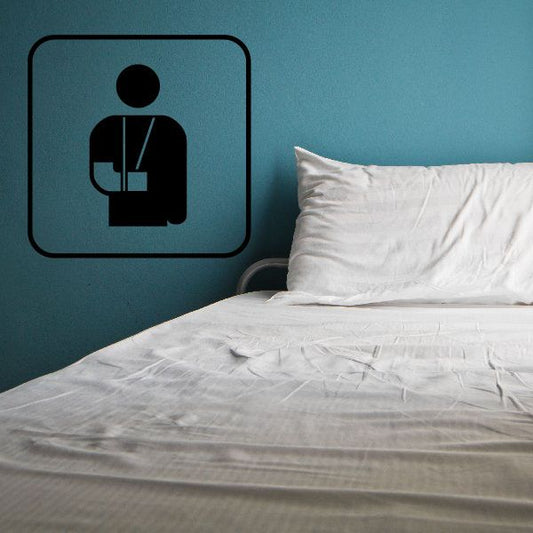Medcal help sign decal with black seated person icon