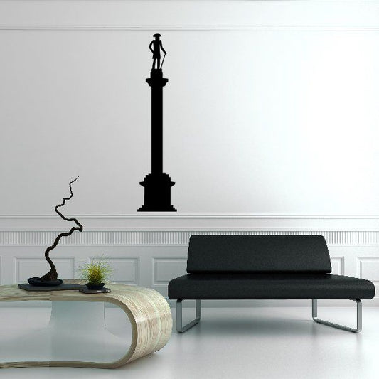 Monument decal with a tall black obelisk silhouette on a wall