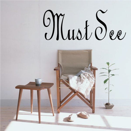 Vinyl wall decal with 'Must See' black script lettering