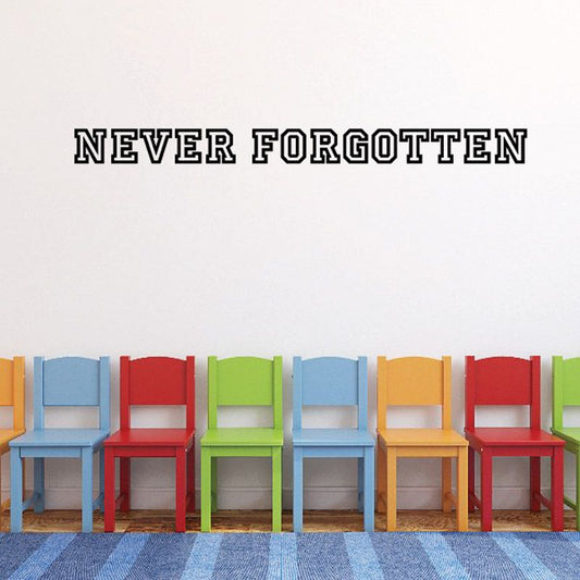 Vinyl wall decal reading 'NEVER FORGOTTEN' in bold black