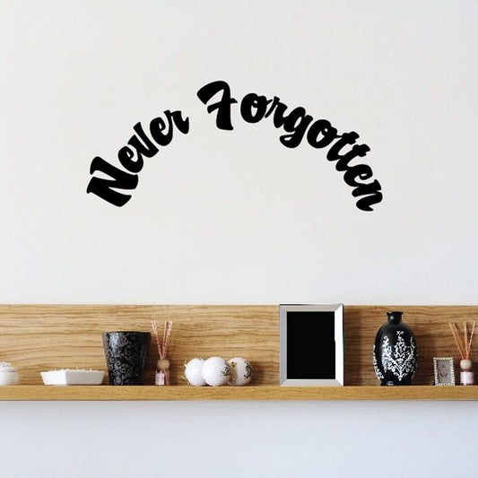 Black “Never Forgotten” vinyl wall decal in arched script lettering