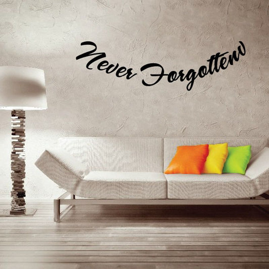 Black cursive wall decal: 'Never Forgotten' memorial lettering