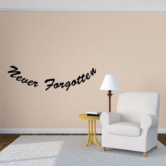 Vinyl wall decal with cursive "Never forgotten" text and small lamp icon