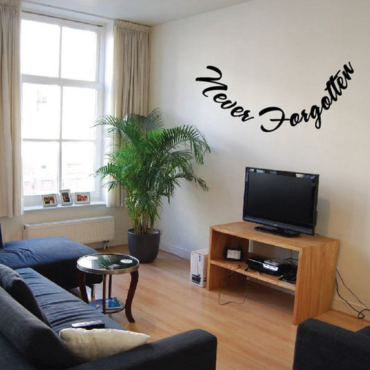 Wall decal with 'Never Forgotten' cursive black lettering