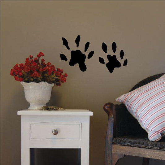 Otter paw print decal with two black paw silhouettes