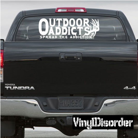 Vinyl decal sticker with white OUTDOOR ADDICTS text and arrow graphic on window