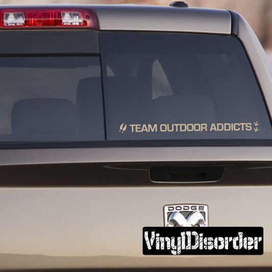Team Outdoor Addicts vinyl decal sticker on car window, reads TEAM OUTDOOR ADDICTS