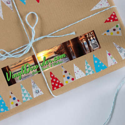 A present adorned with a packaging sticker and tied with a ribbon