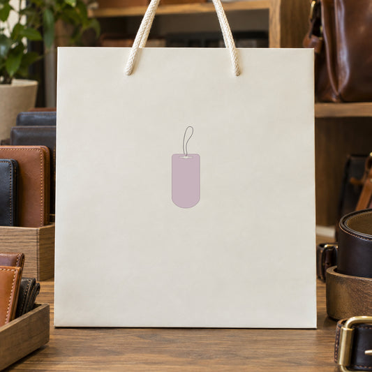 Price tag sticker with hanging tag icon on light paper shopping bag