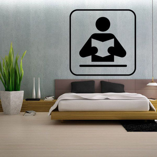 Reading sign wall decal with black seated reader icon in rounded square