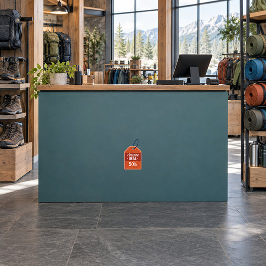 Amazing Deal 50% Retail Discount Sign Sticker displayed on a outdoor equipment store checkout counter