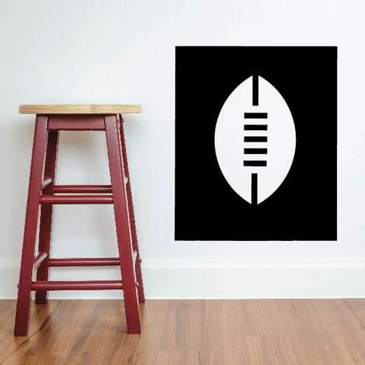 Rugby ball decal with white oval and black stripe detail on a black square