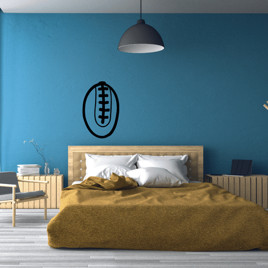 Rugby ball wall decal on a blue wall