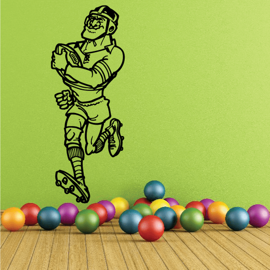 Rugby player wall decal holding a ball with black outline
