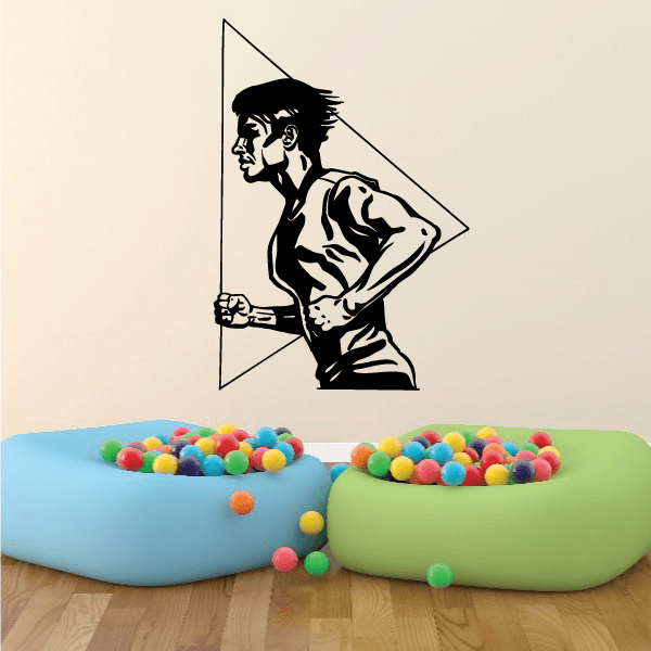 Running wall vinyl decal of a muscular man in a dynamic pose, black silhouette