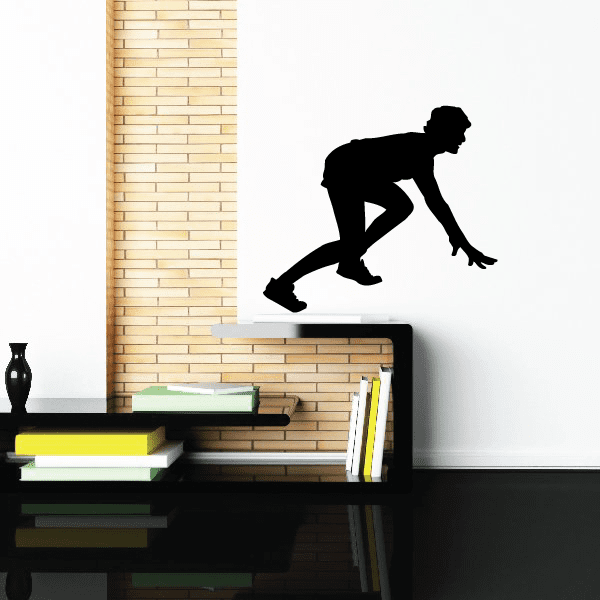 Vinyl wall decal of a black runner sprinting, silhouette style