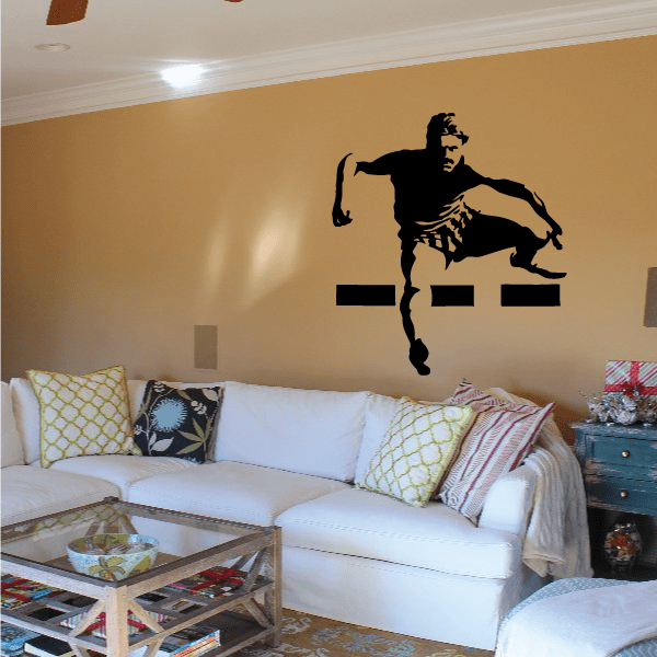 Black wall vinyl decal of a muscular runner in mid-stride