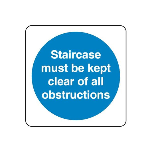 Safety sign decal: blue circle with white text, 'Staircase must be kept clear of all obstructions'