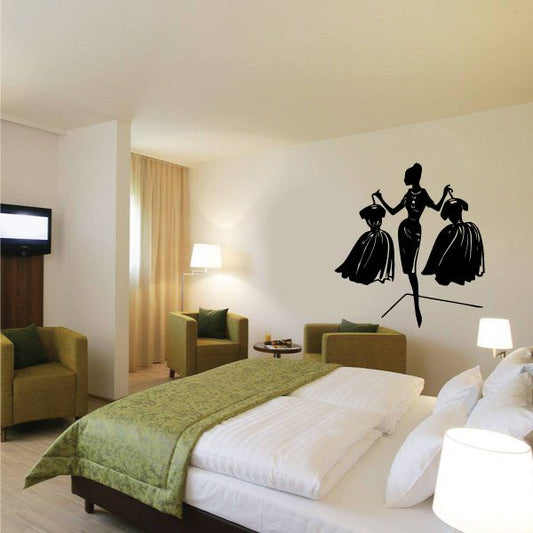 Fashion girl wall decal with three black silhouette figures in dresses