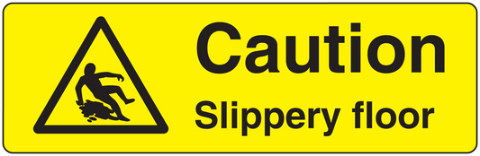 Yellow caution floor sticker: black triangle warning and text 'Caution Slippery floor'.